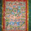 Beautiful tangka with Green Tara image. Painted by mineral and golden paints on textile