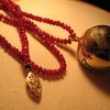 Globe pendant on garnet beads